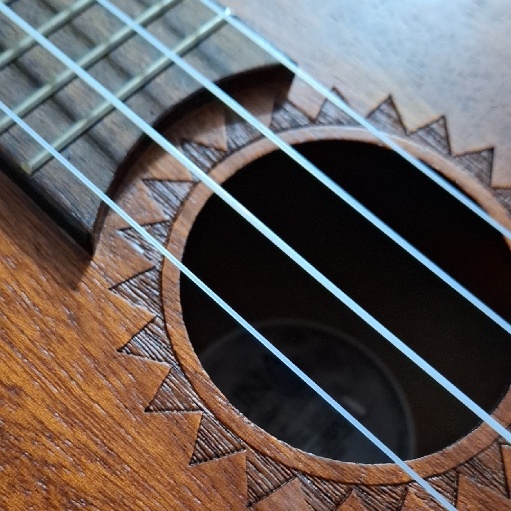 Intricately Carved Brown Ukulele - Picture 6 of 7